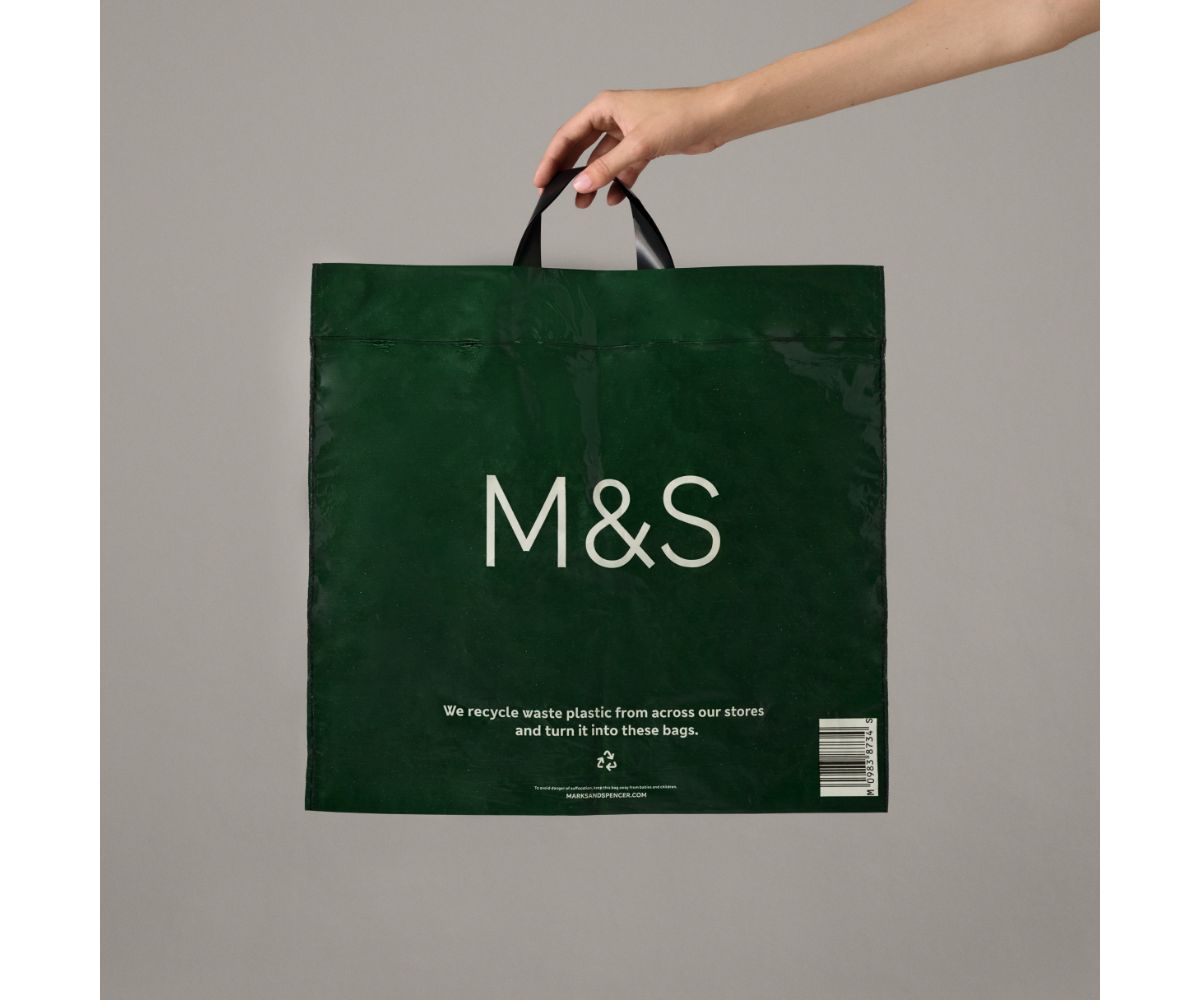 M&S colleague handing a Bag for Life to a customer