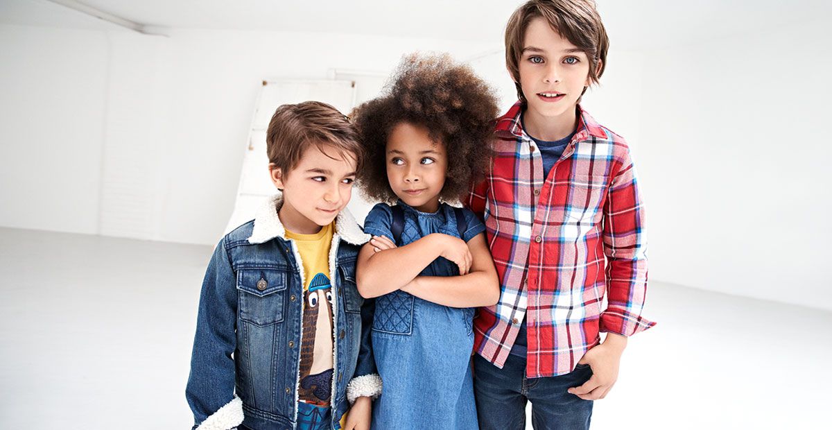 Kids in denim jeans, jackets and dresses